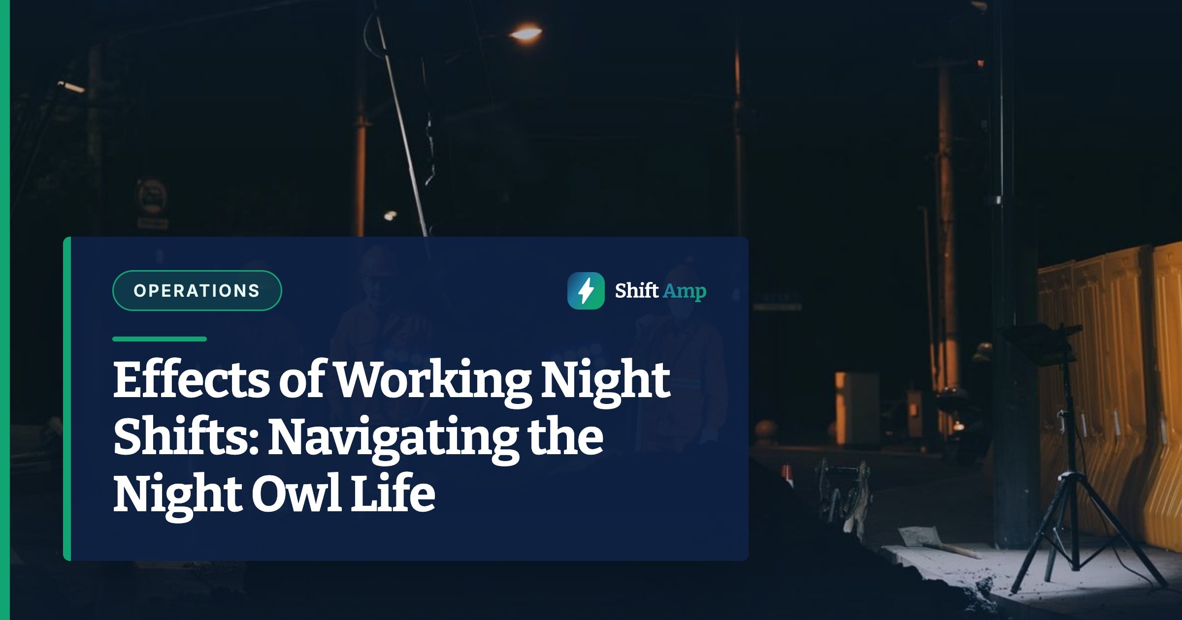 Workers in reflective gear and helmets conduct roadworks at night under bright lights.