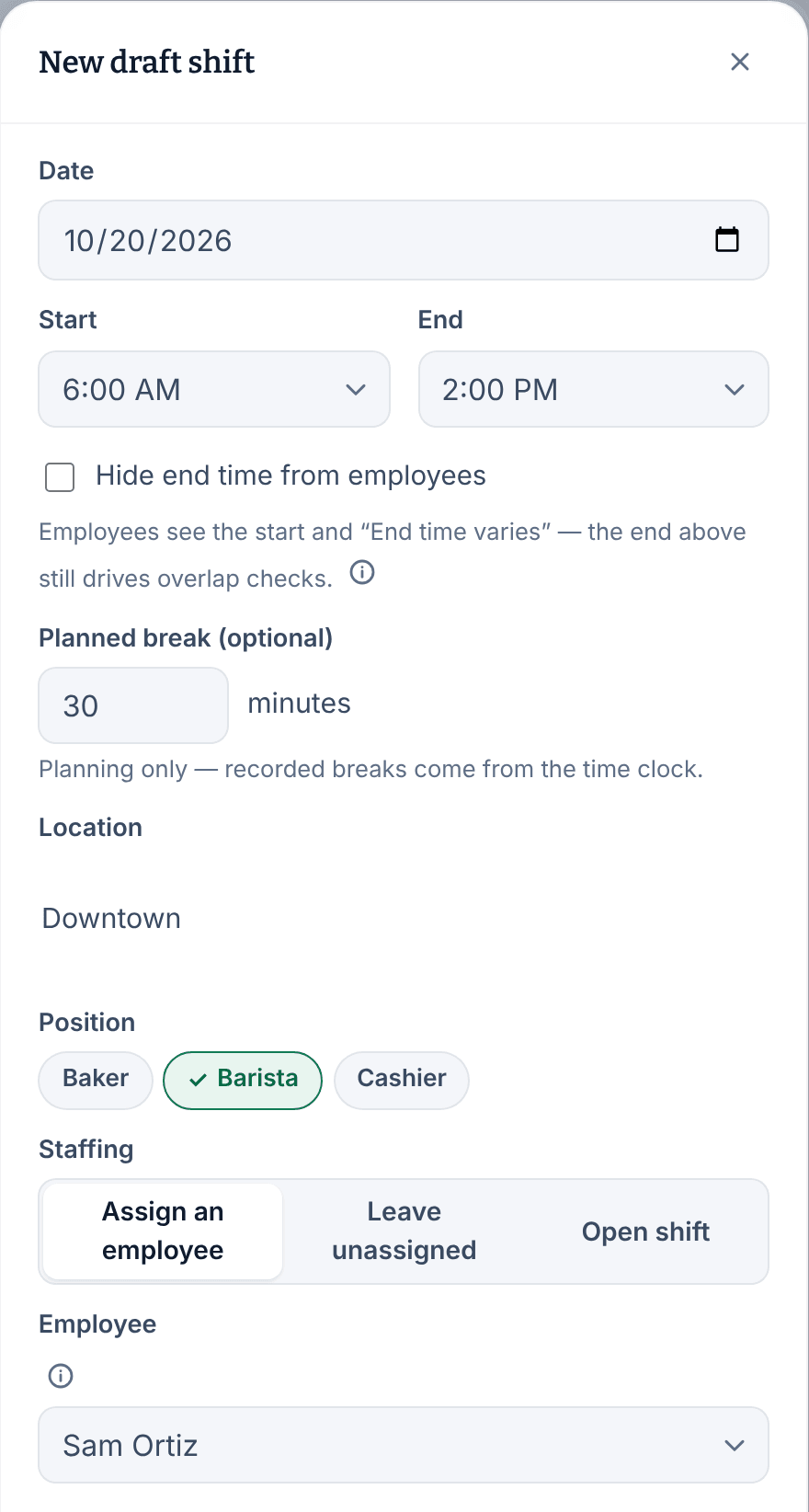 The New draft shift panel with the date 10/20/2026, a start of 6:00 AM and an end of 2:00 PM, a 30-minute planned break, Downtown as the location, Barista chosen, Assign an employee selected and Sam Ortiz under Employee.